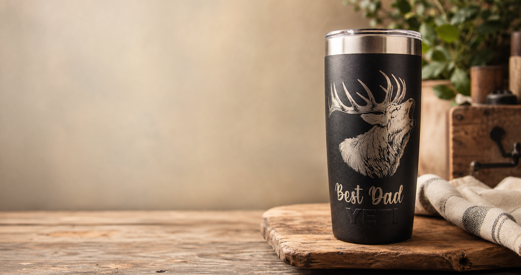 Custom engraved insulated drink bottles arranged on a workshop bench