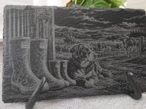 Slate engraved with farm dog, cows, and adult and kid gumboots
